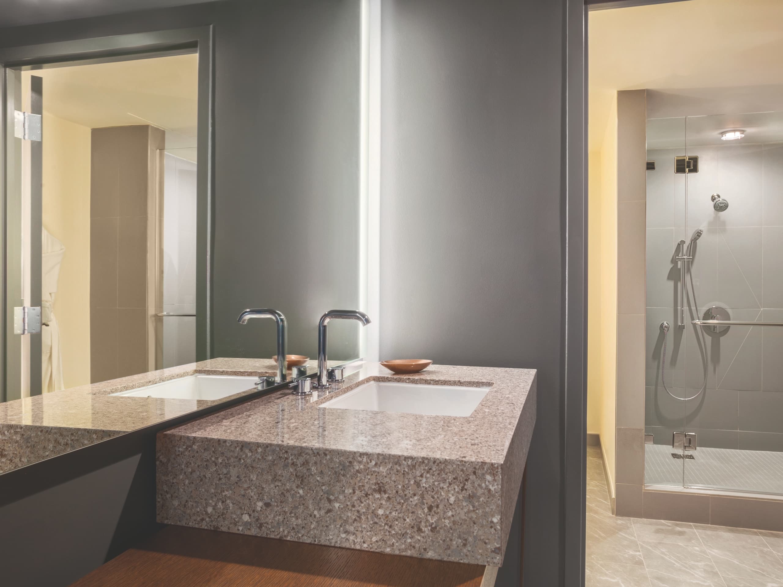 Hyatt Regency Houston imperial suite guest bathroom with soaking tub and his & hers sinks