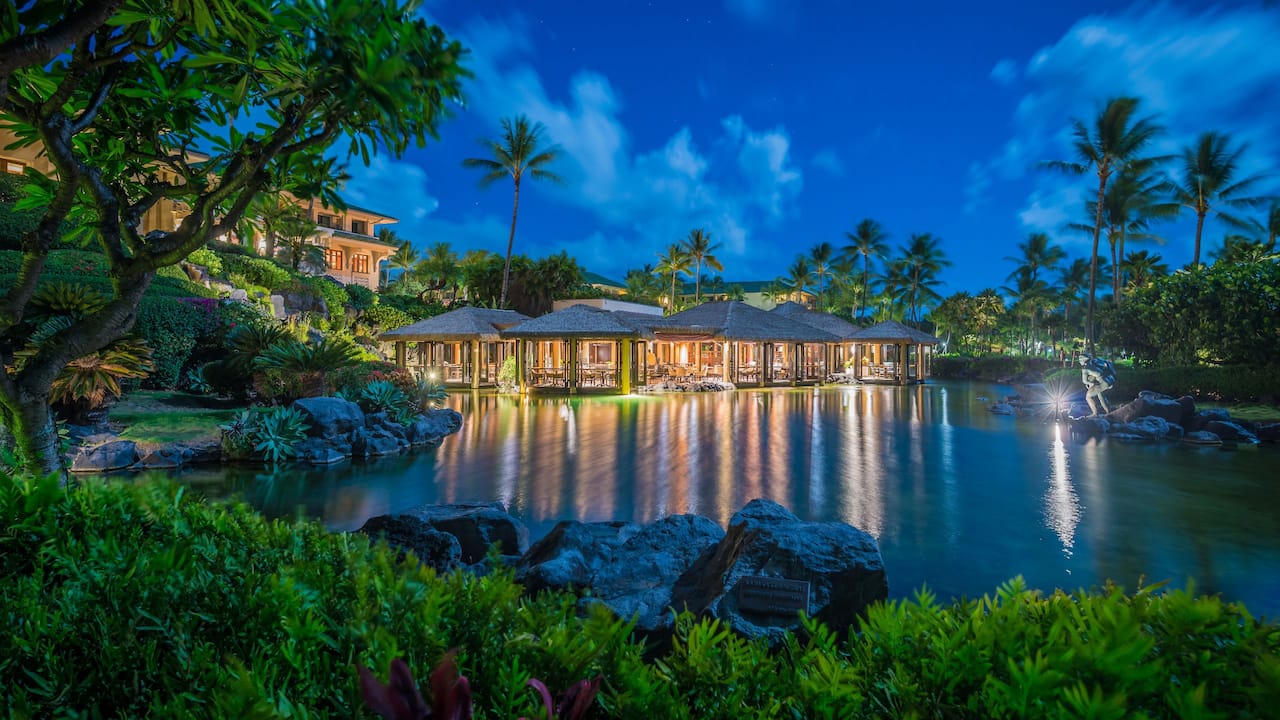 Tidepools Restaurant overlooking the lagoon at night at Grand Hyatt Kauai Resort and Spa