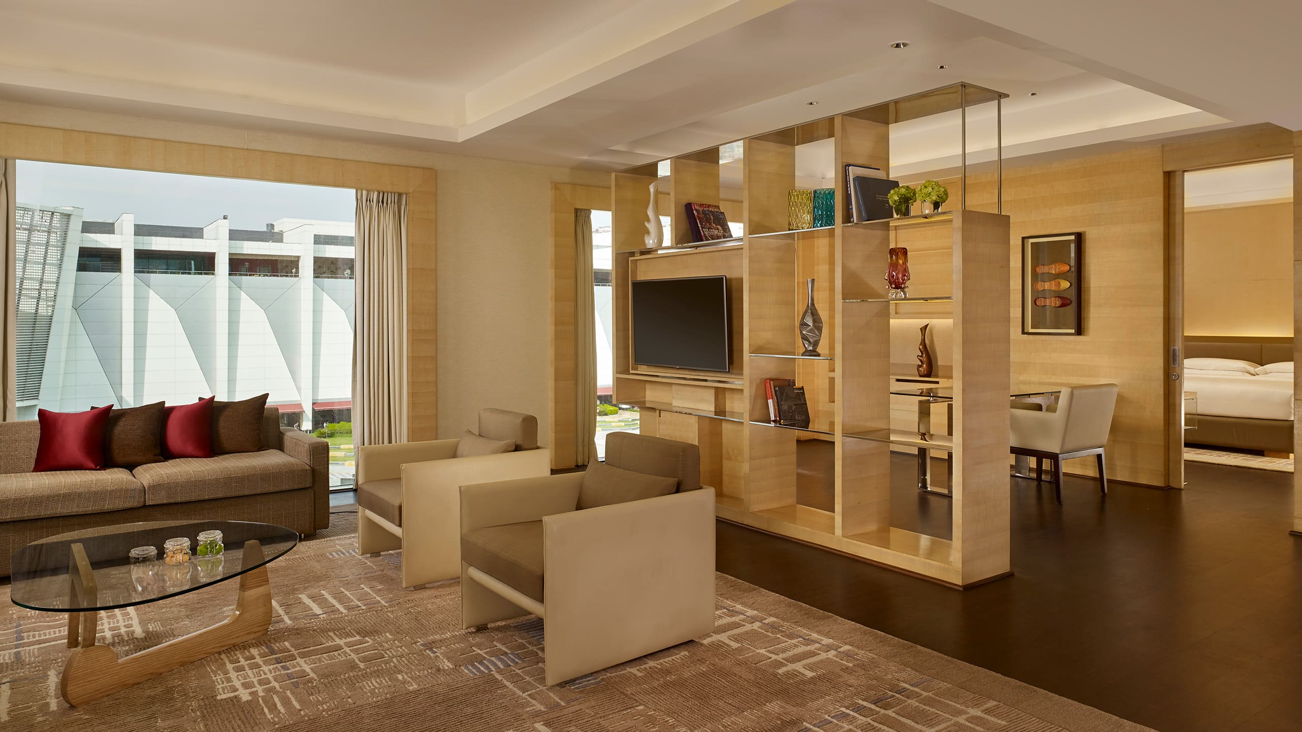 Dining, living and bedroom areas of hotel suite