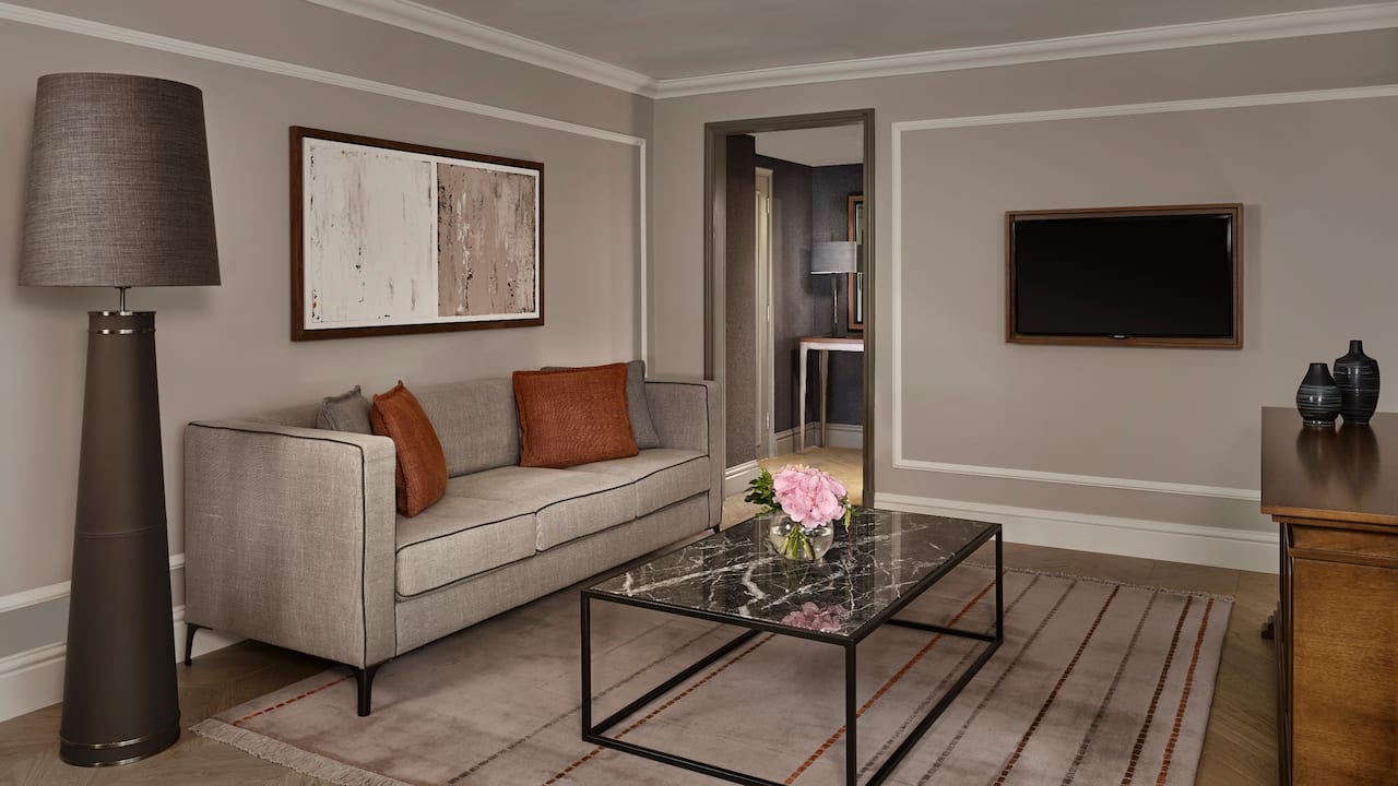 Living room area with sofa and coffee table in Regency Suite