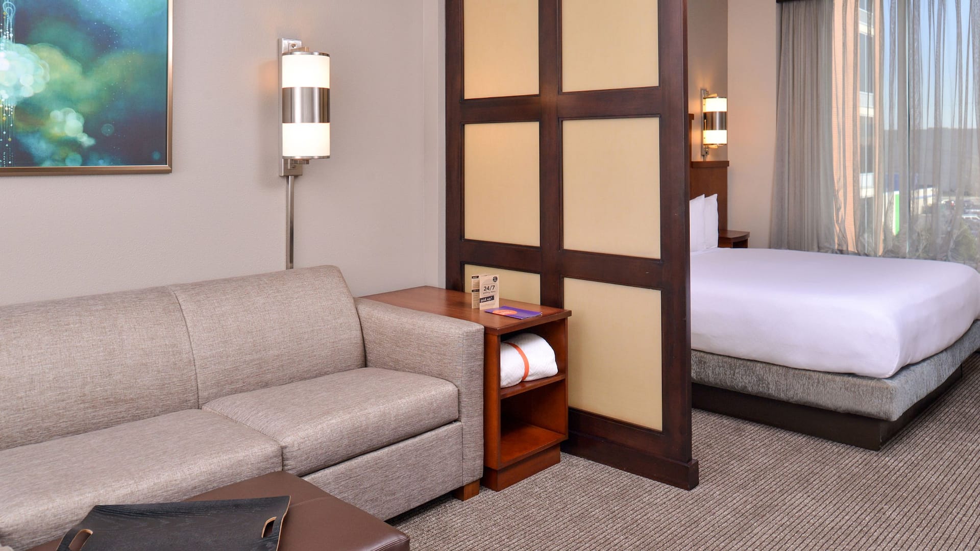 Hyatt Place Garden City King Bed Living Sleeping Areas