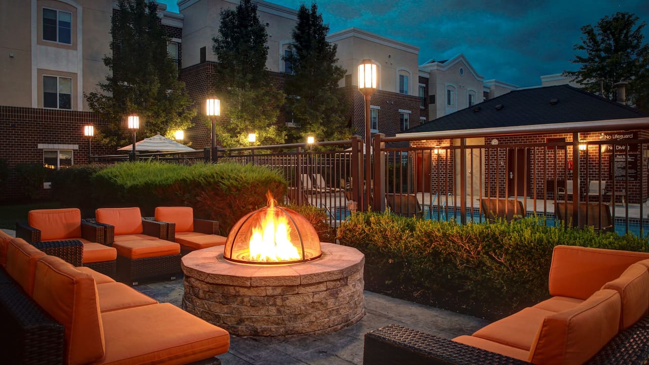 Patio at Branchburg Hotel with seating area and fireplace at Hyatt house Branchburg