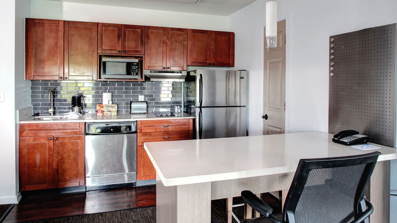 Hyatt House Branchburg suite with desk and kitchen