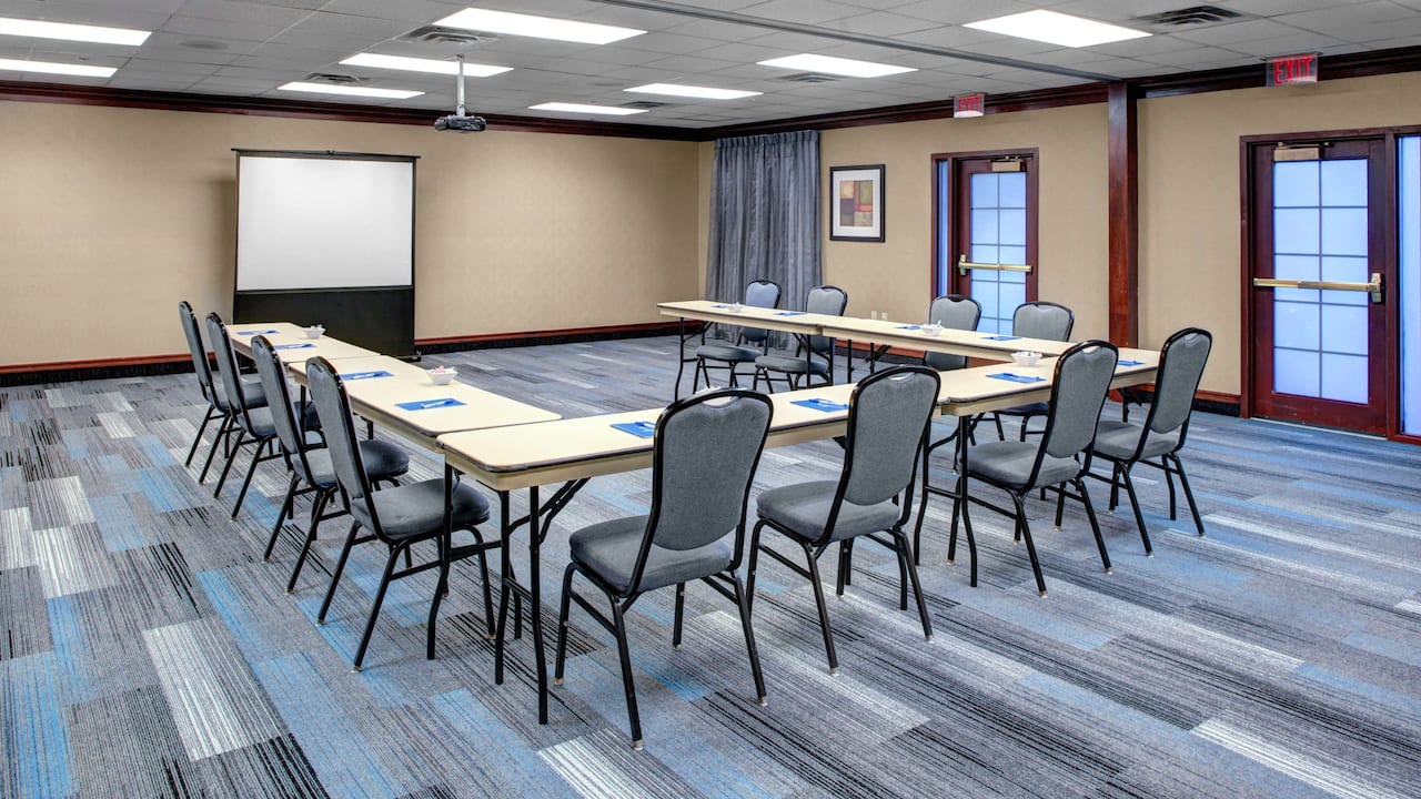 Meeting room space near Boston set up in u shape with projector at Hyatt House Boston / Burlington