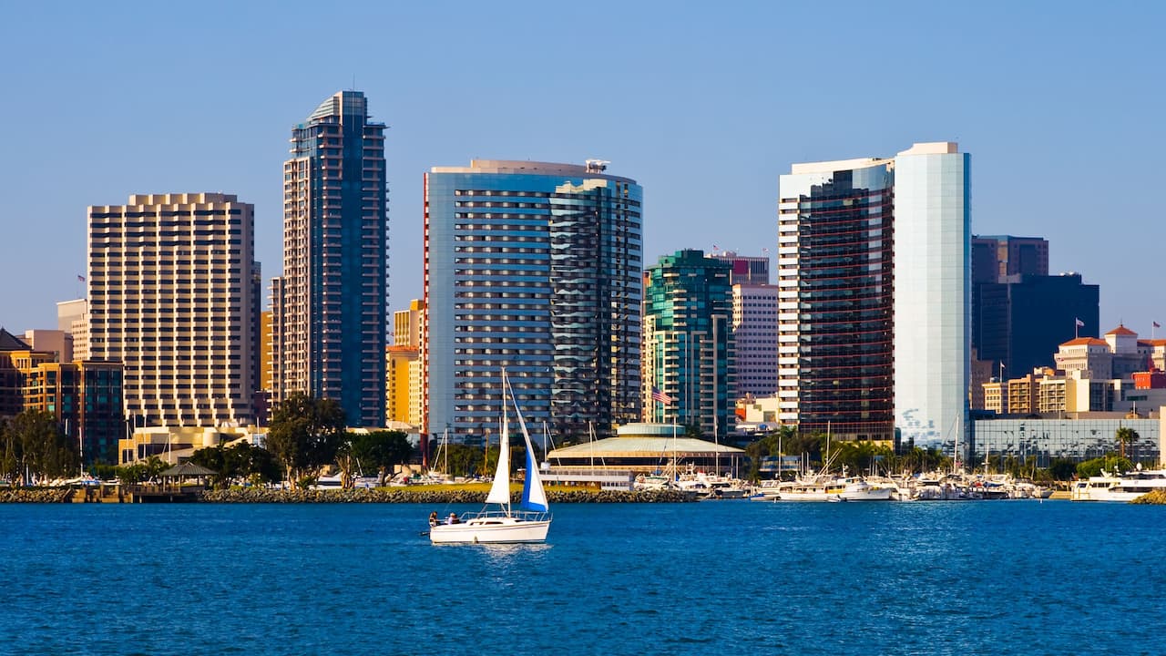 Sail boat on North San Diego Bay with city skyline