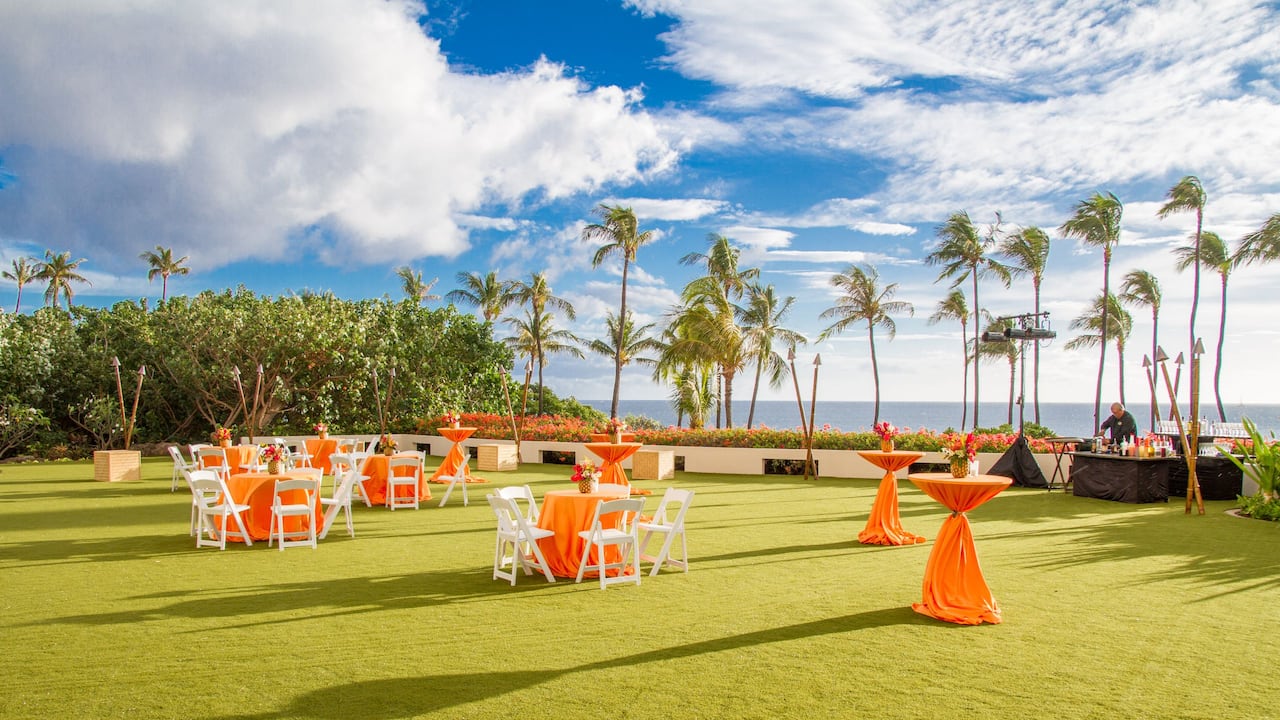 Halona Kai outdoor reception with banquet setup and cocktail tables