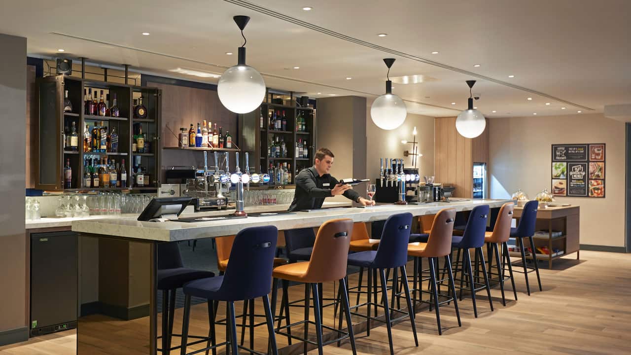Interior Coffee to Cocktails Bar With Host