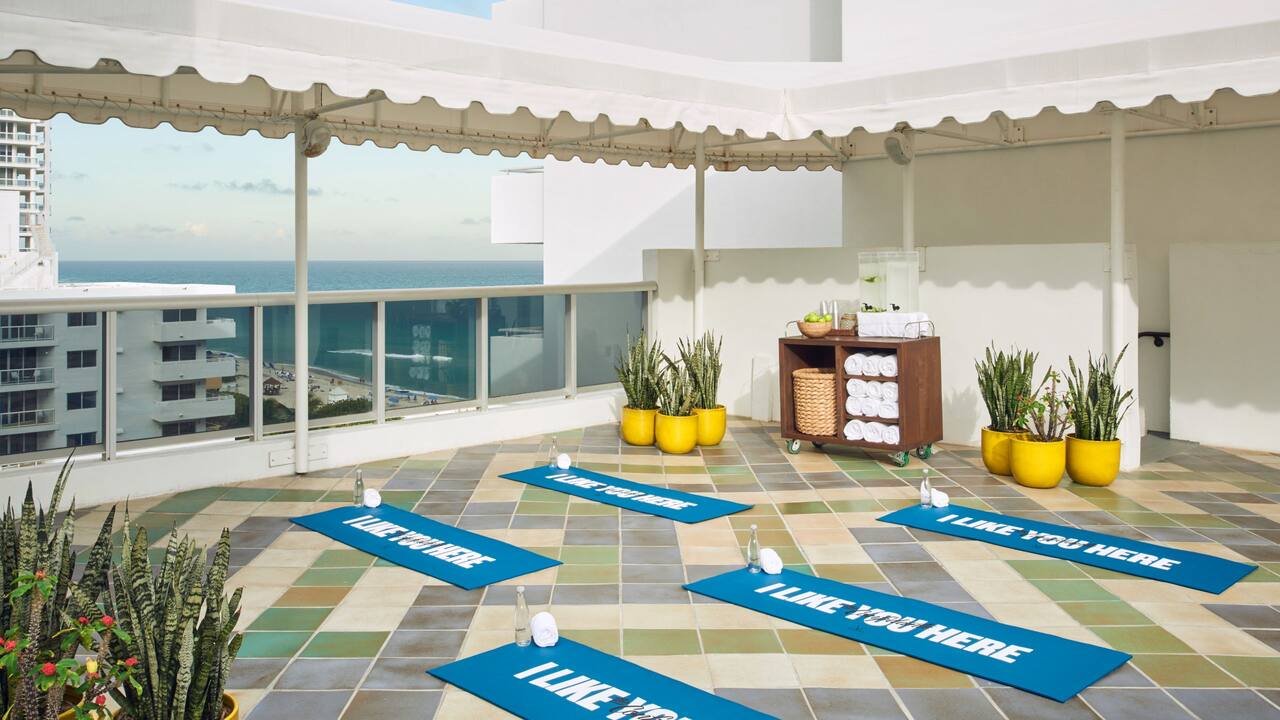 Fitness terrace with ocean views and set up for a yoga class