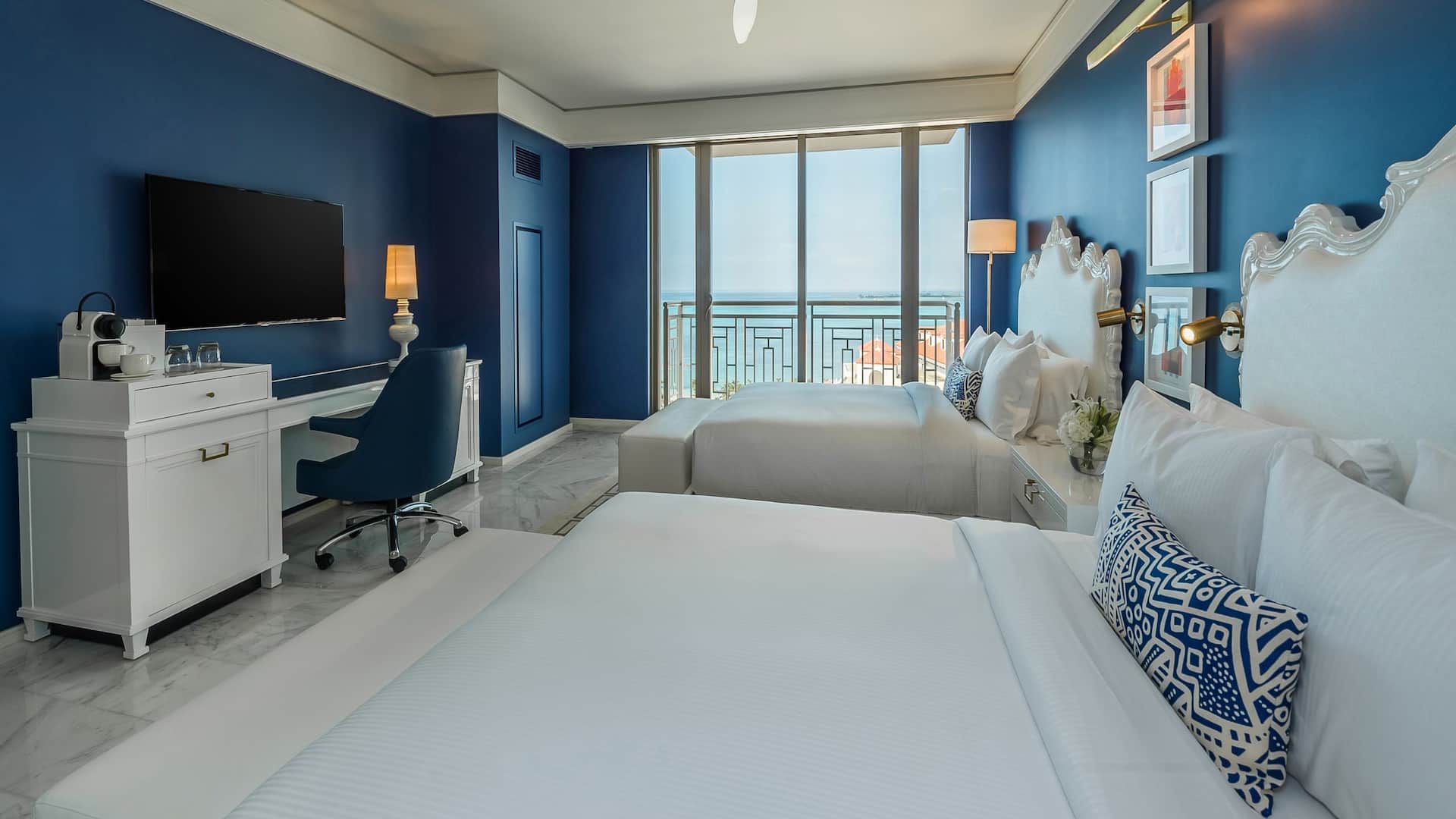 3/4 A spacious two queen bedroom with a beachfront balcony view in Nassau Bahamas
