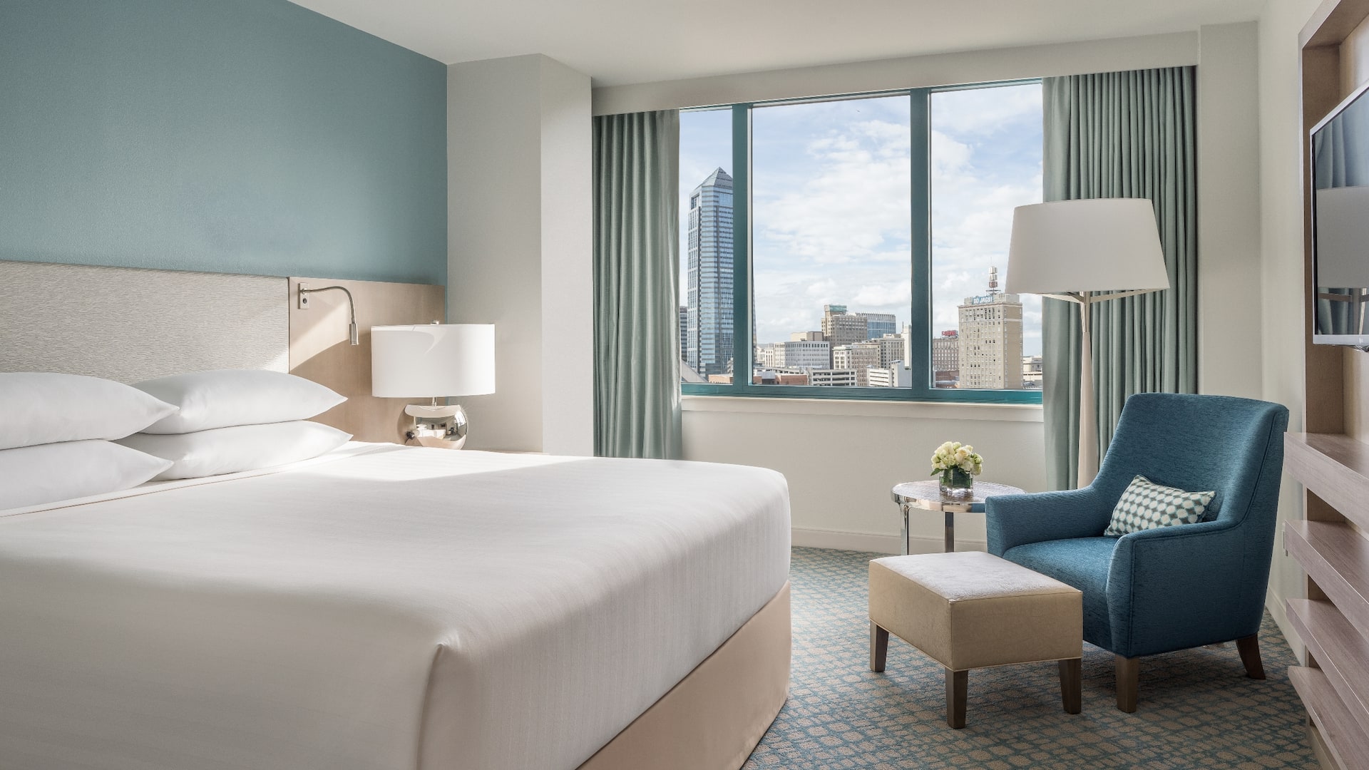 One King Bed River View guest room with armchair and view