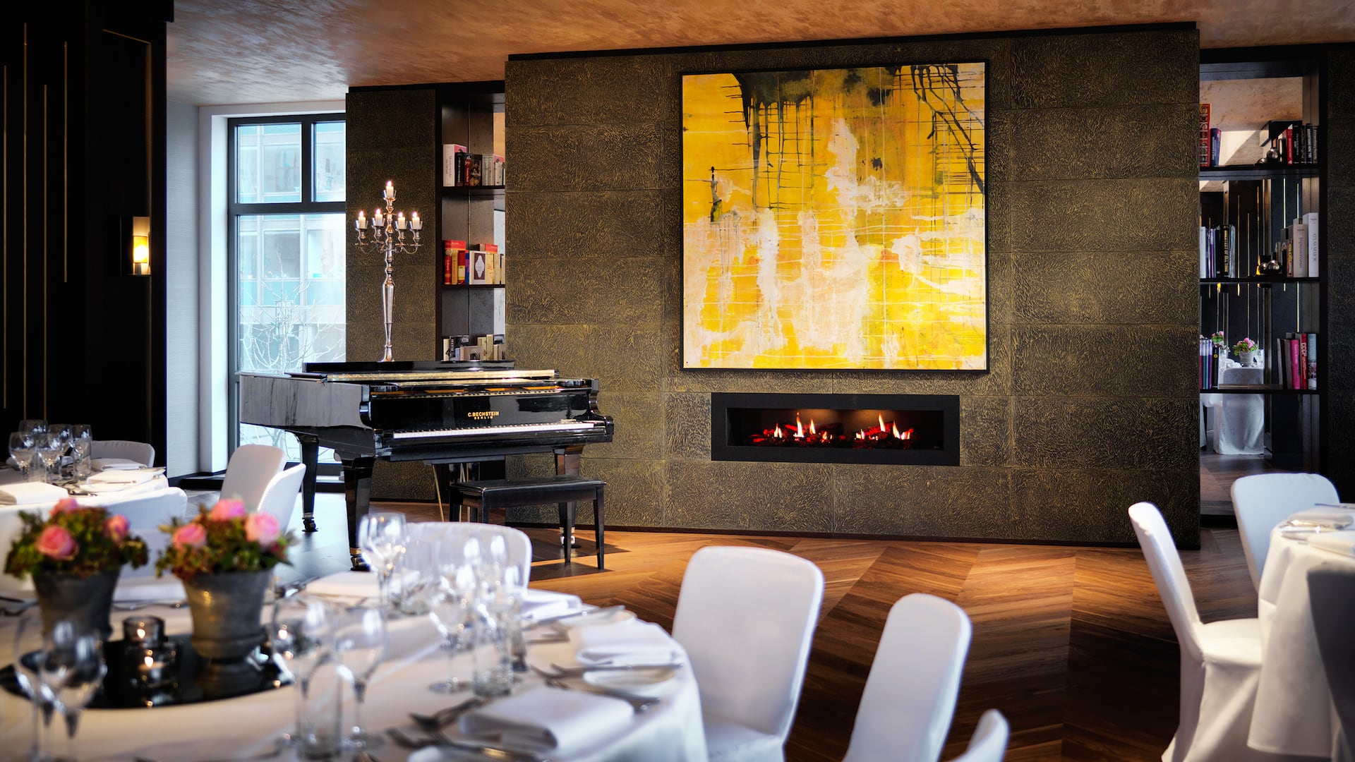 5 of 12 Festively set table in the Riverside meeting room with piano and parquet floor at Hyatt Regency Cologne