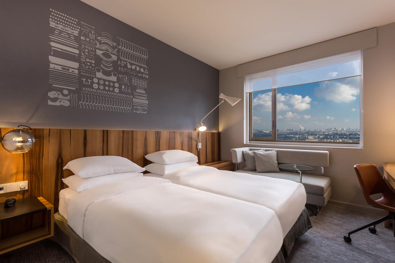Chambre Deluxe lits jumeaux à l'Hôtel Hyatt Regency Paris Etoile
