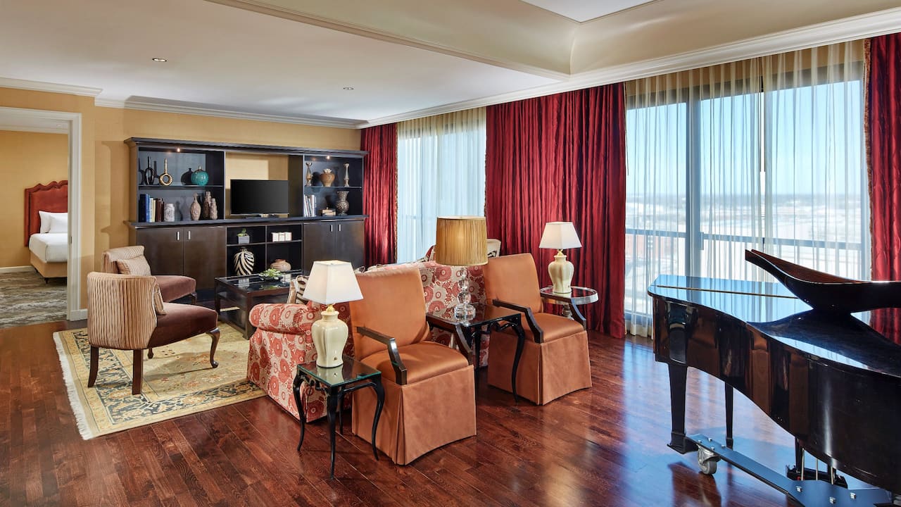 Hotel Chairman Suite with living room and city skyline view at Hyatt Regency Tulsa Downtown.