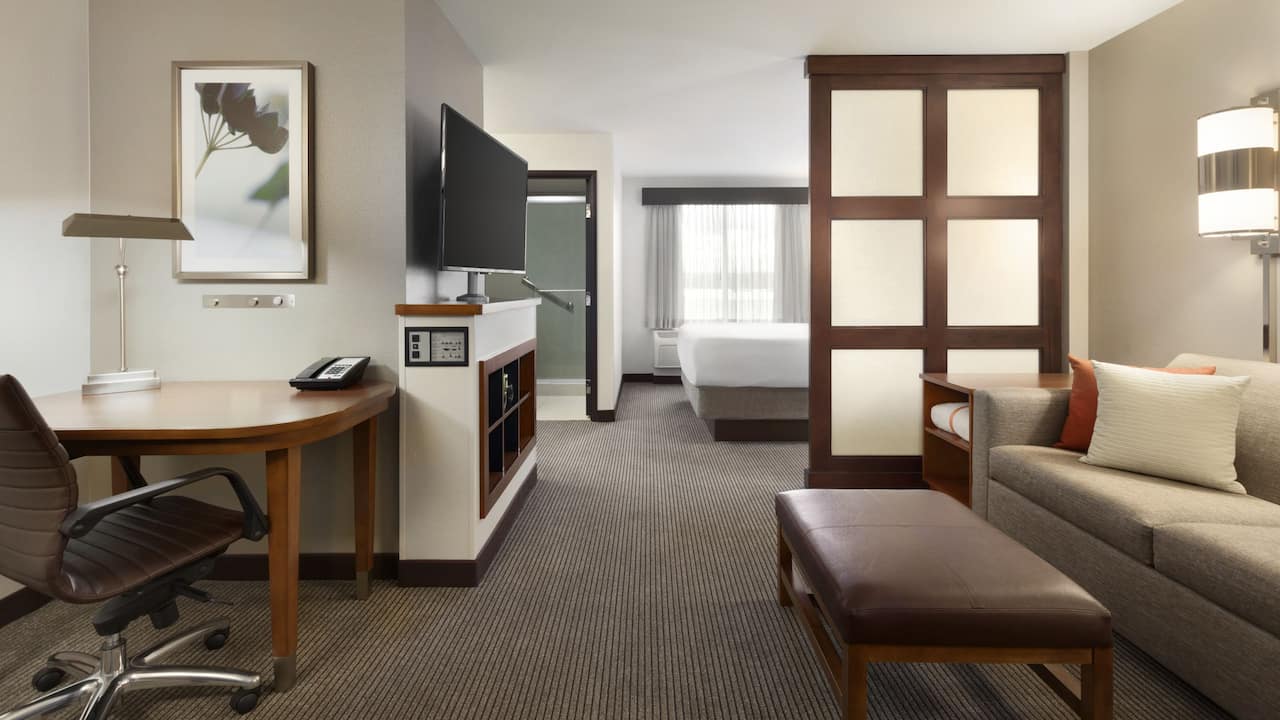 Enjoy our spacious King Bed Guest rooms with a separated living area, sofa bed and workspace.
