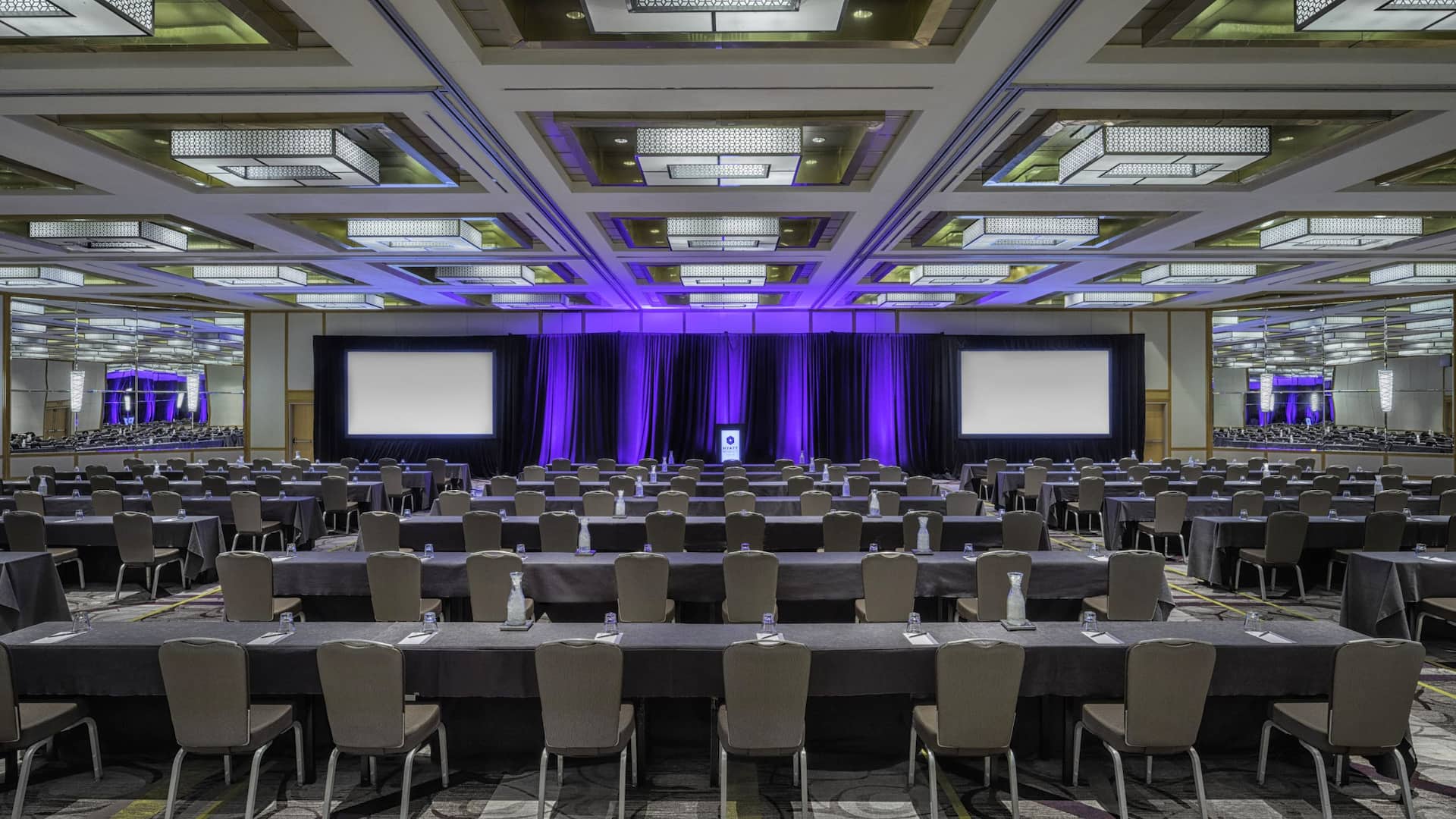 Rows of chairs in large hotel ballroom