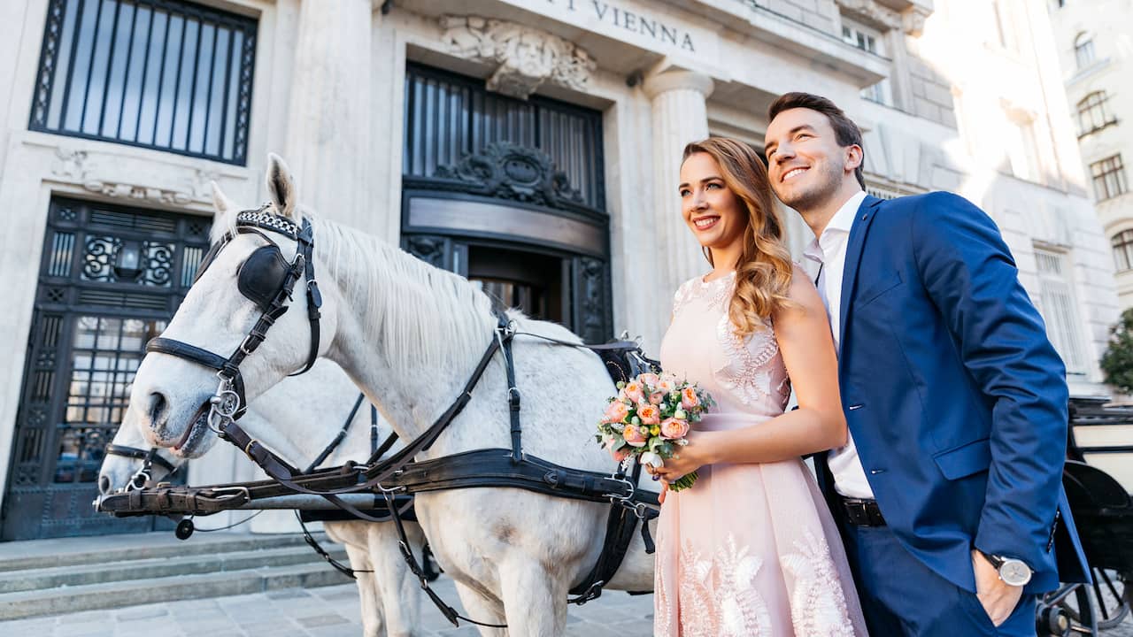 Couple In Front of Hotel Carriage