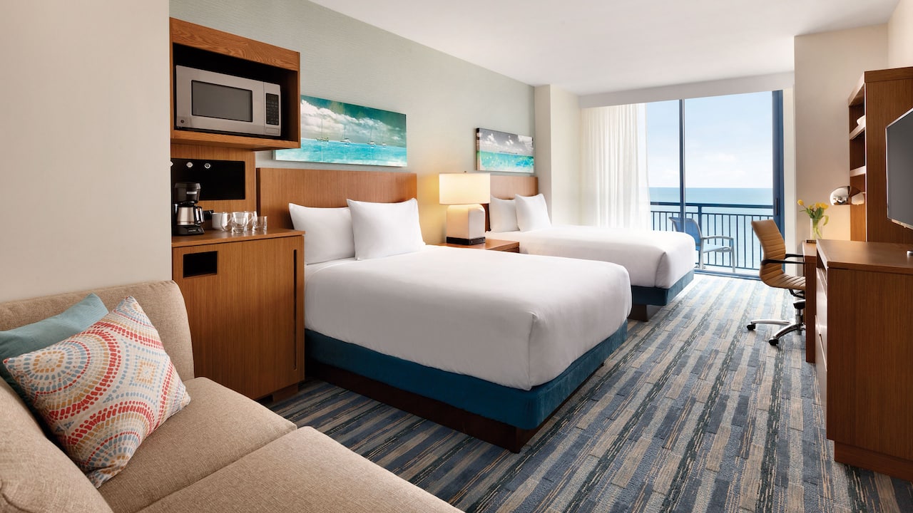Oceanfront den guestroom with two queen beds at Hyatt House Virginia Beach Oceanfront
