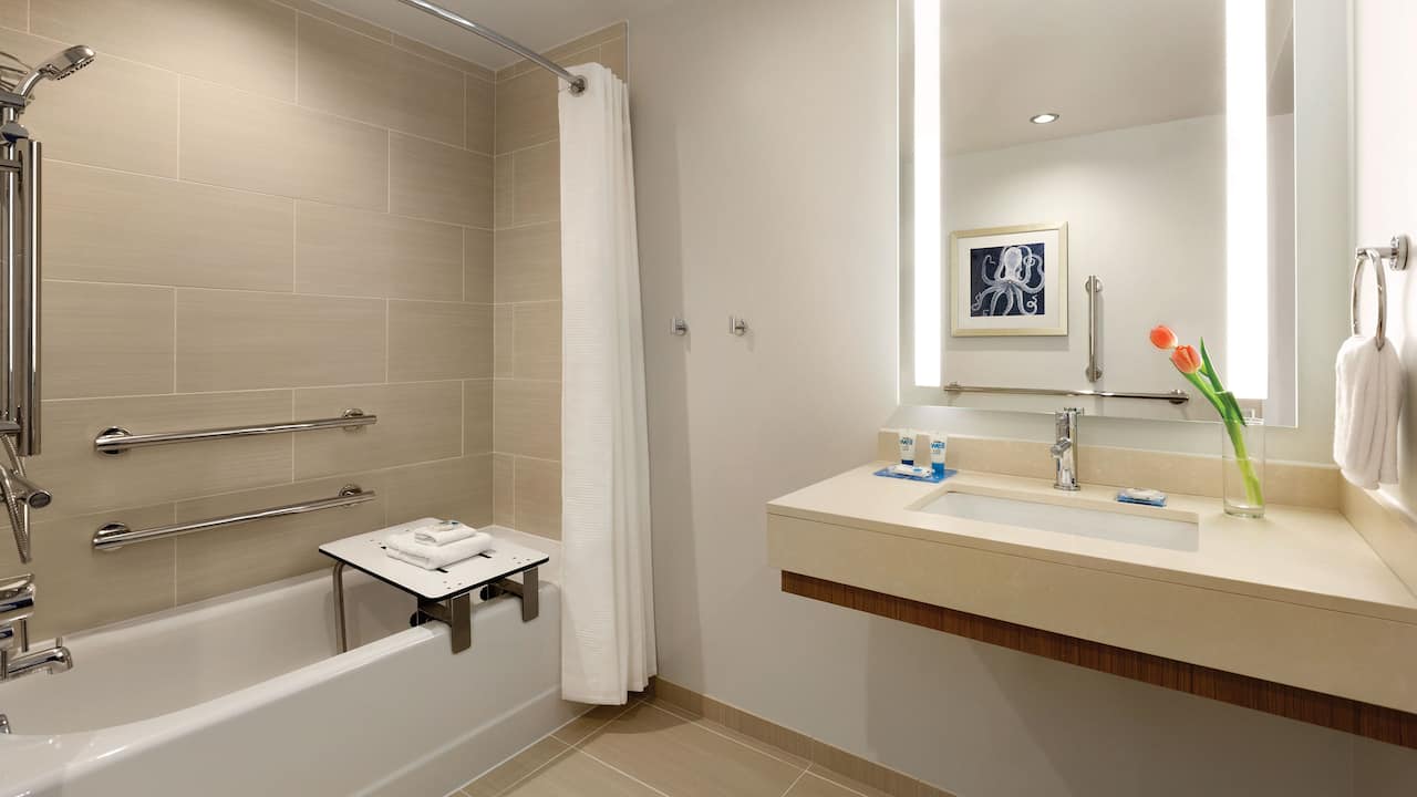 Accessible guest bathroom with tub