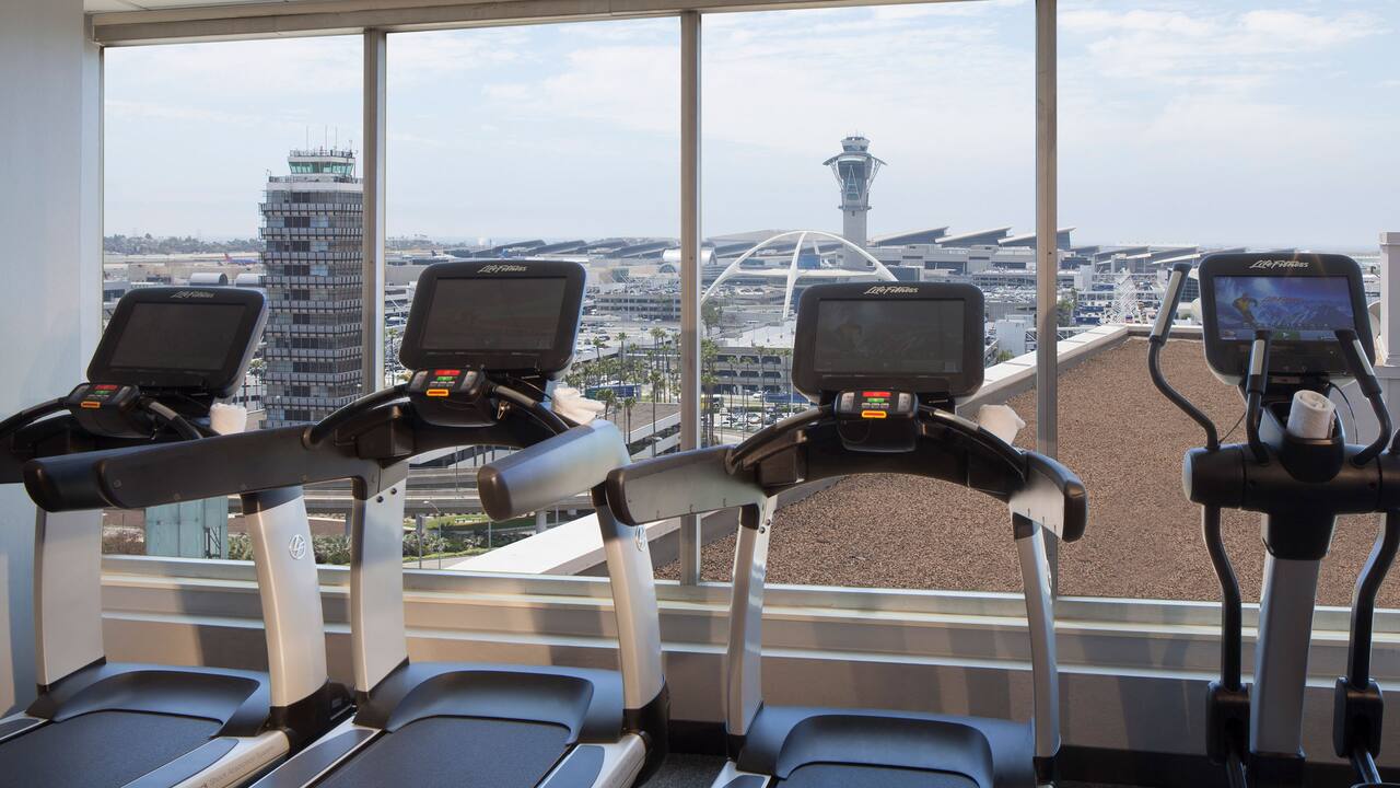 Fitness Center with treadmills overlooking the airport