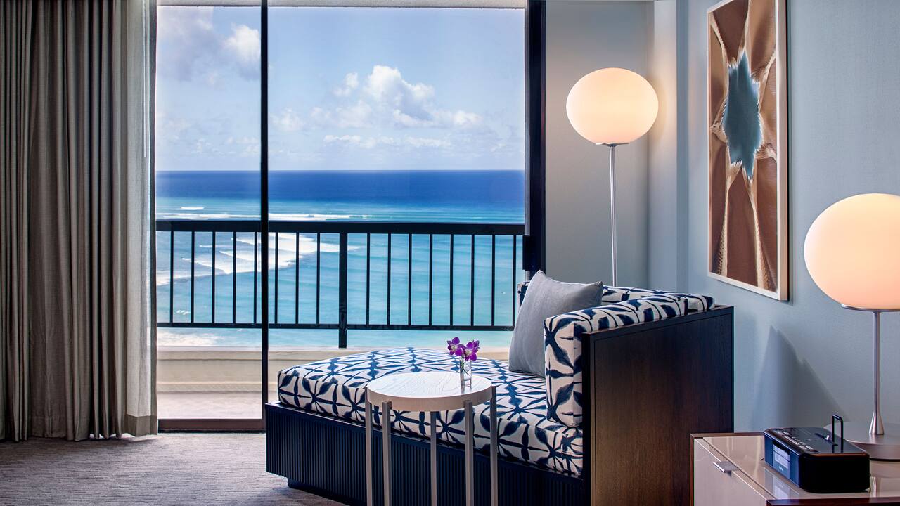 Ocean View Guestroom with lounge chair by the balcony