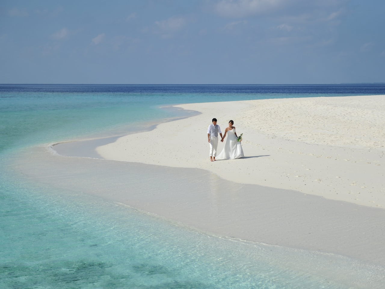 Maldives wedding packages couple walking