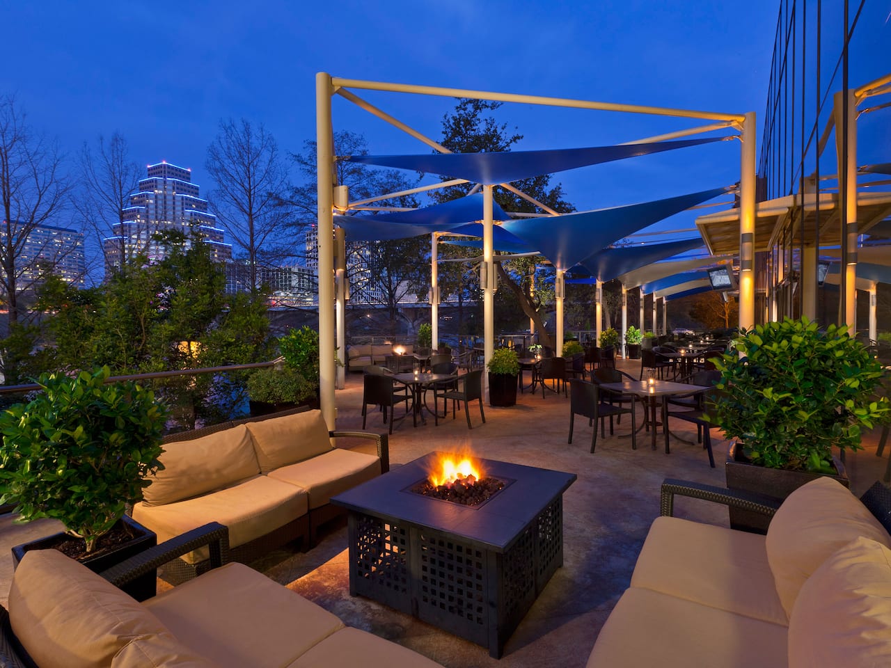 Outdoor patio area overlooking Lady Bird Lake at a hotel in Downtown Austin