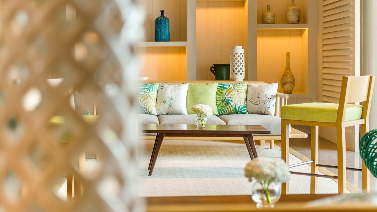 The Living Room seating area with sofa and chairs