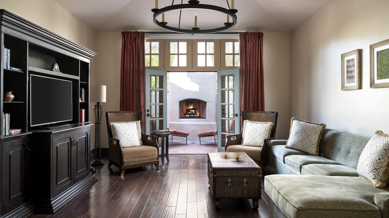 Presidential Villa living room with view of outdoor fireplace