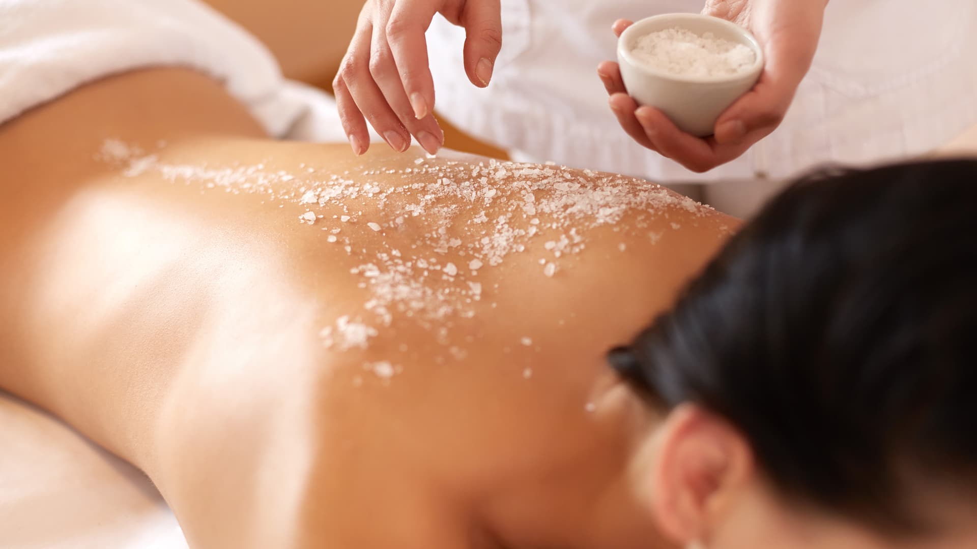 Body scrub on back of woman