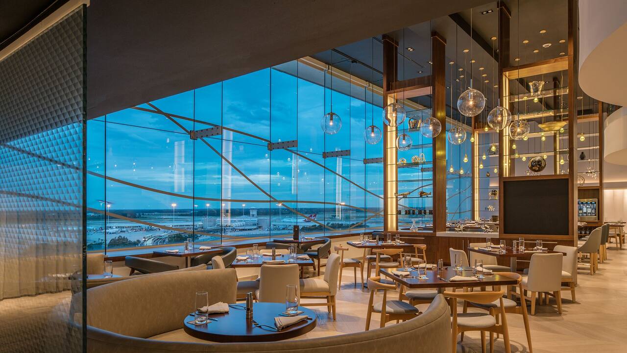 Hemisphere Restaurant dining area with large floor-to-ceiling windows