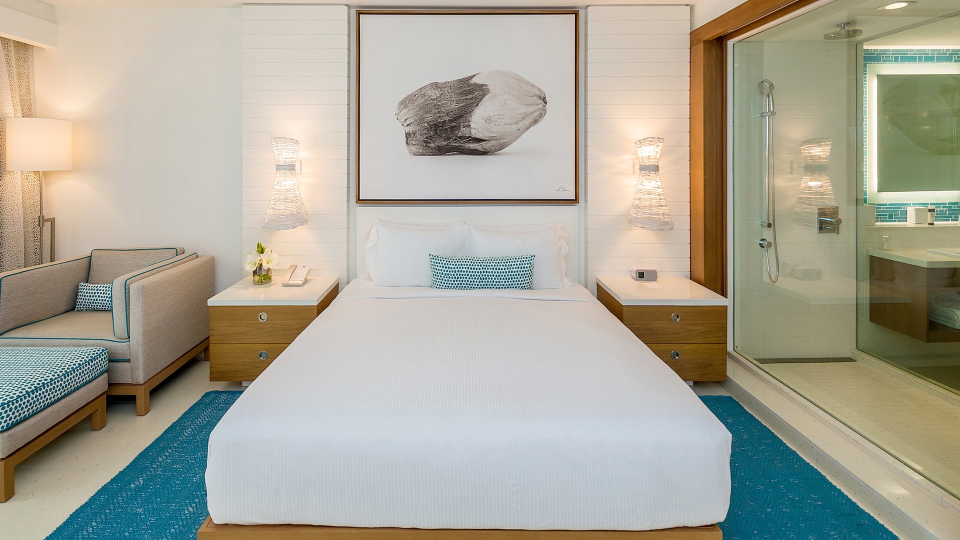 1/4 guestroom standard blue king bed and bathroom