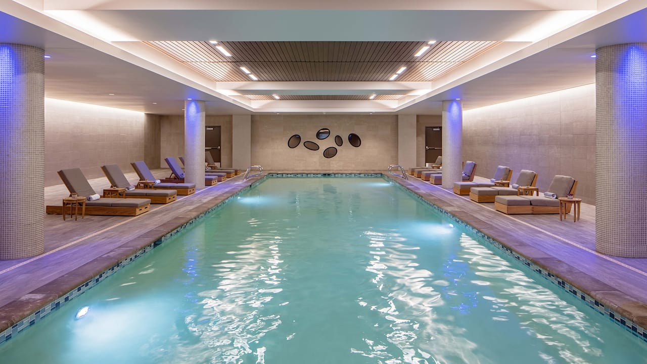 Hotel near Seattle airport’s Indoor pool with lounge chairs