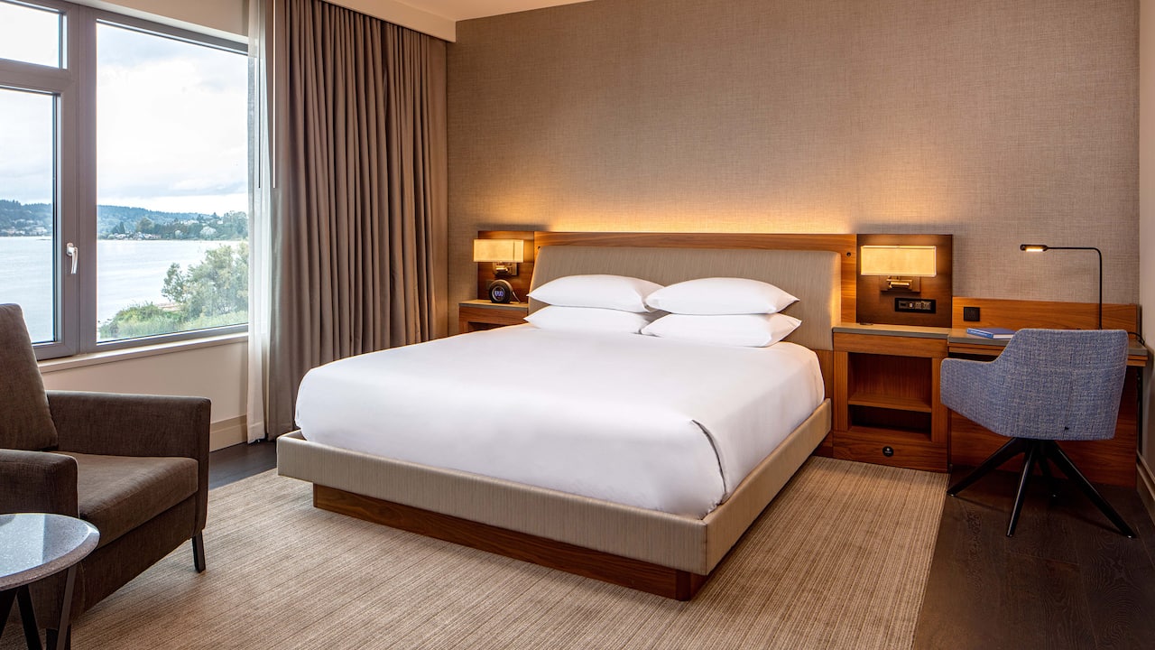 king bedroom with lakeview Hyatt Regency Lake Washington at Seattle’s Southport