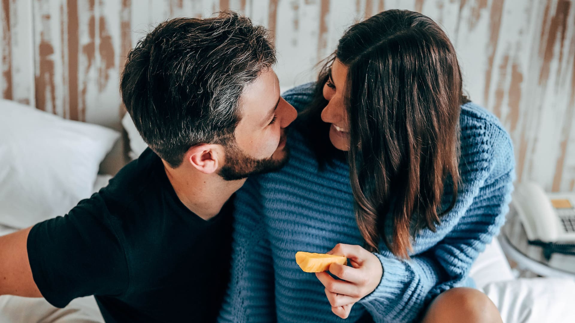 Couple enjoying breakfast in bed at Hyatt Regency Mainz