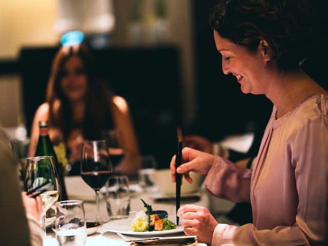 Woman enjoys Sushi at Vox Restaurant at Grand Hyatt Berlin