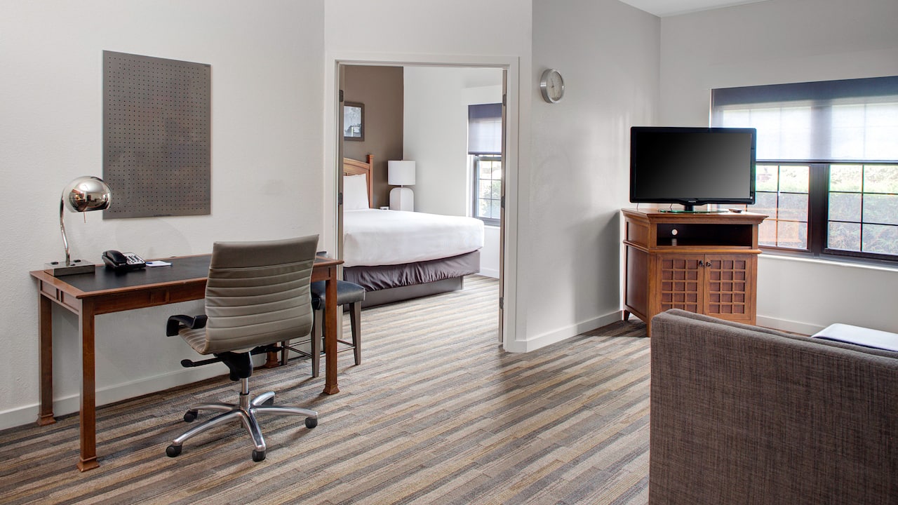 Parsippany hotel guestroom with desk and tv at Hyatt House Parsippany East