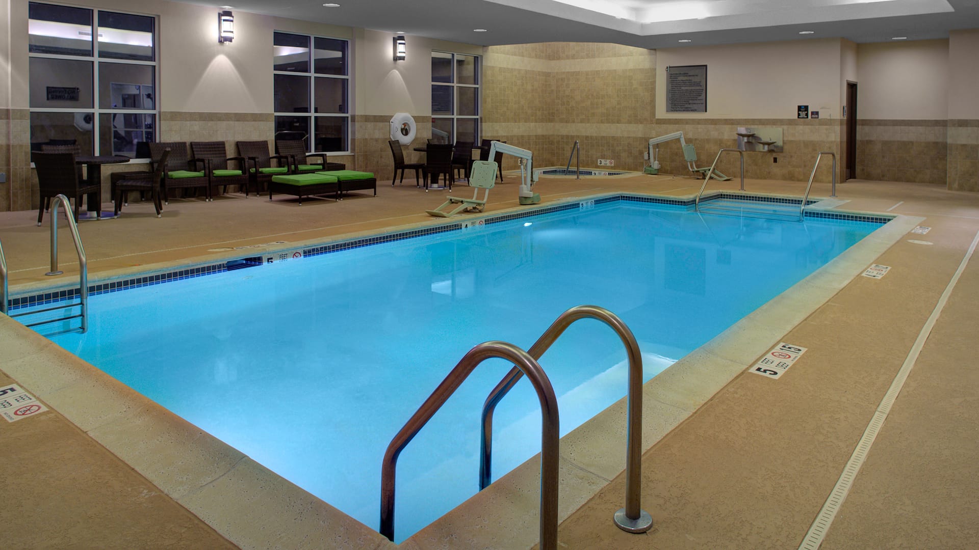 Indoor pool with ADA lift and pool seating area at Hyatt House Shelton
