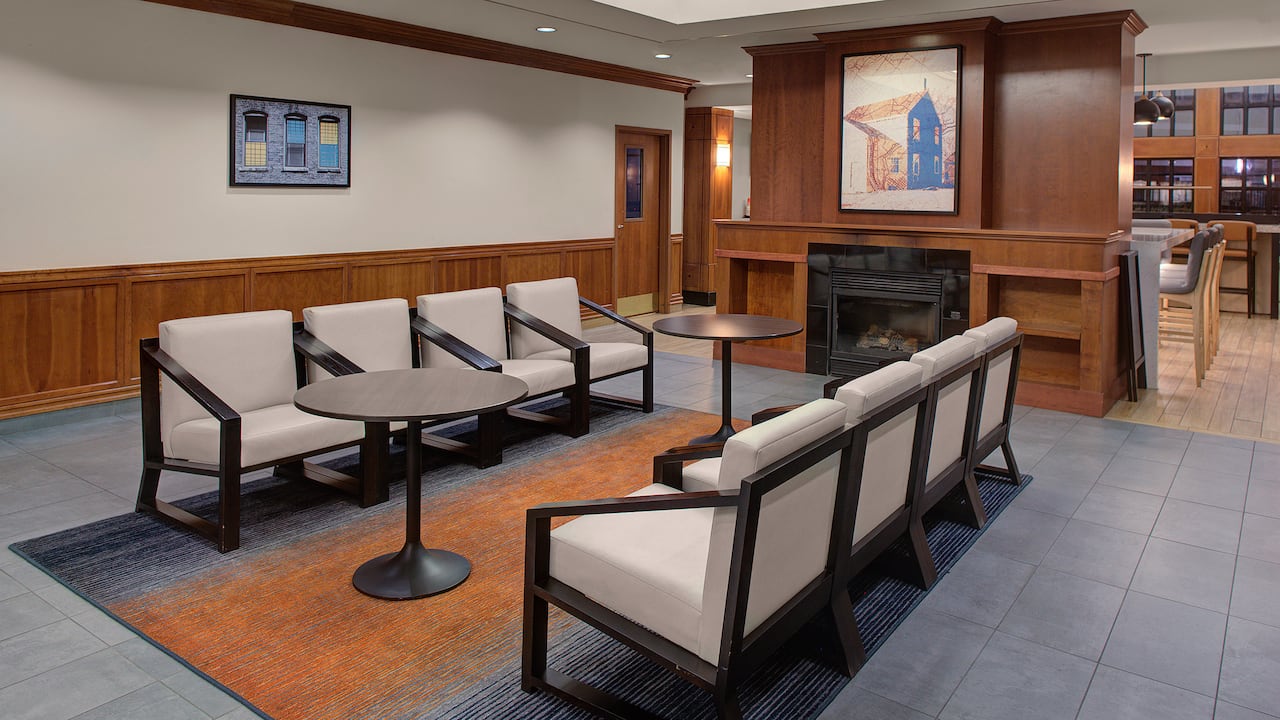 Lobby seating area with couch, lamps, and coffee table at Hyatt House Philadelphia / Plymouth Meeting