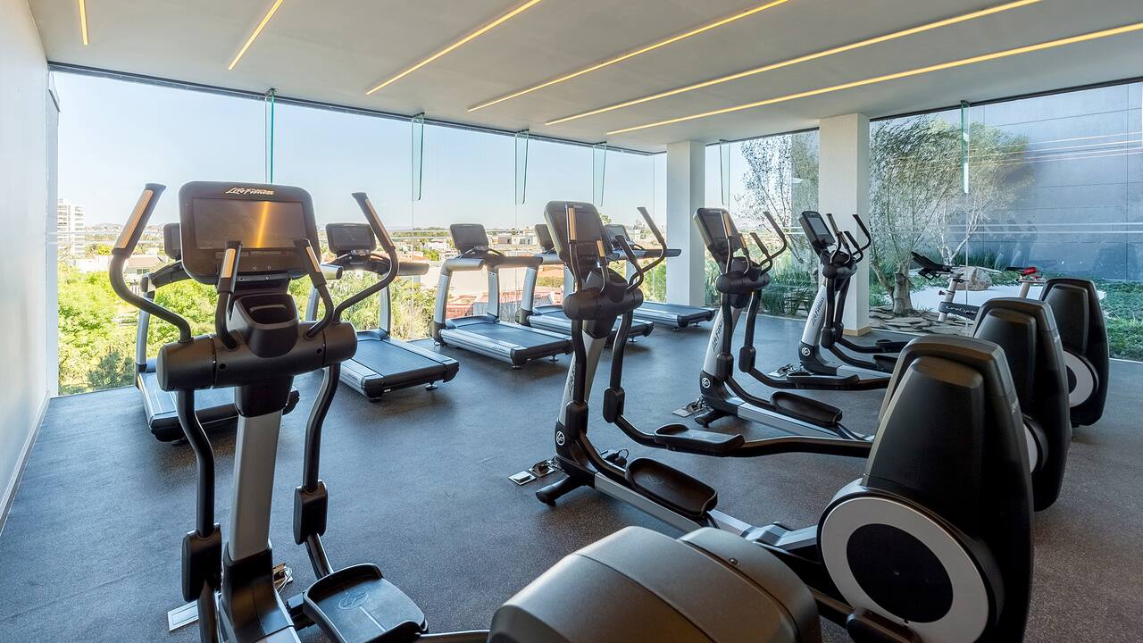 Fitness Center with cardio equipment and floor-to-ceiling windows