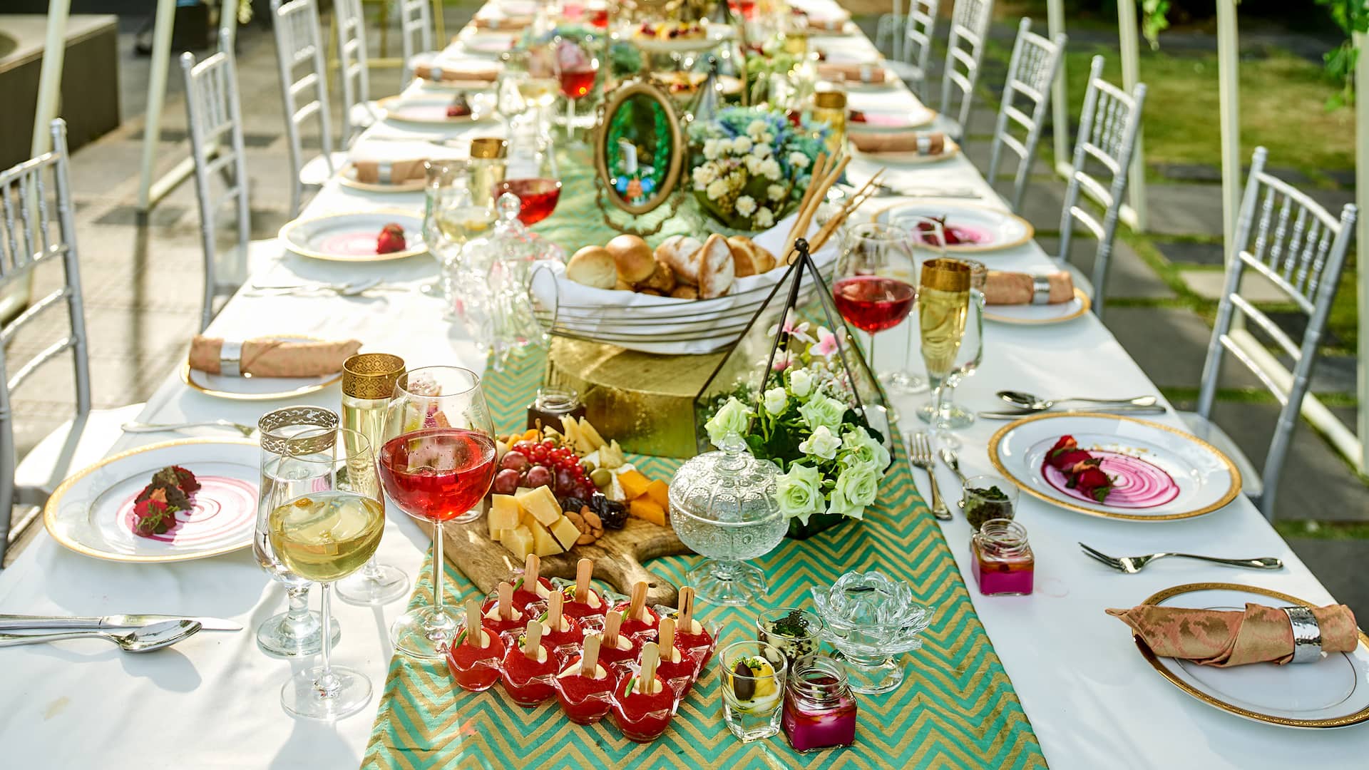 Buffet setup with amazing food in a lush green lawn