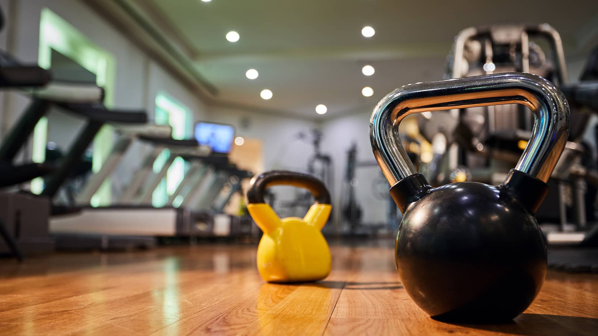 Kettle bells & other modern equipment for various workouts at the fitness center of this luxury hotel Athens Acropolis.