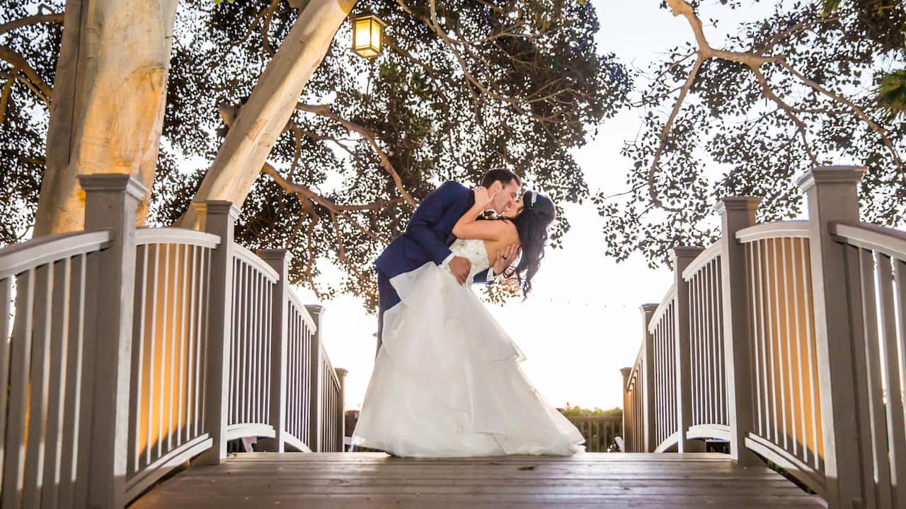 A man and a woman embracing at their San Diego wedding