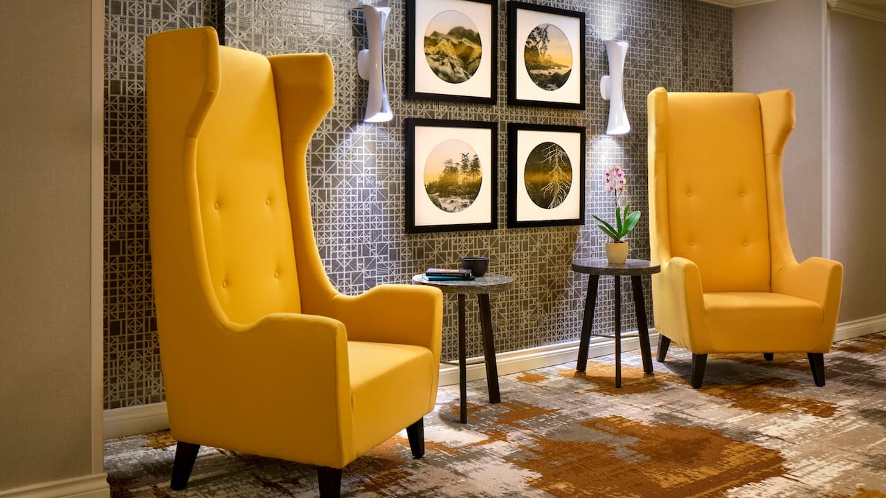 Guest floor elevator lobby with modern wingback chairs