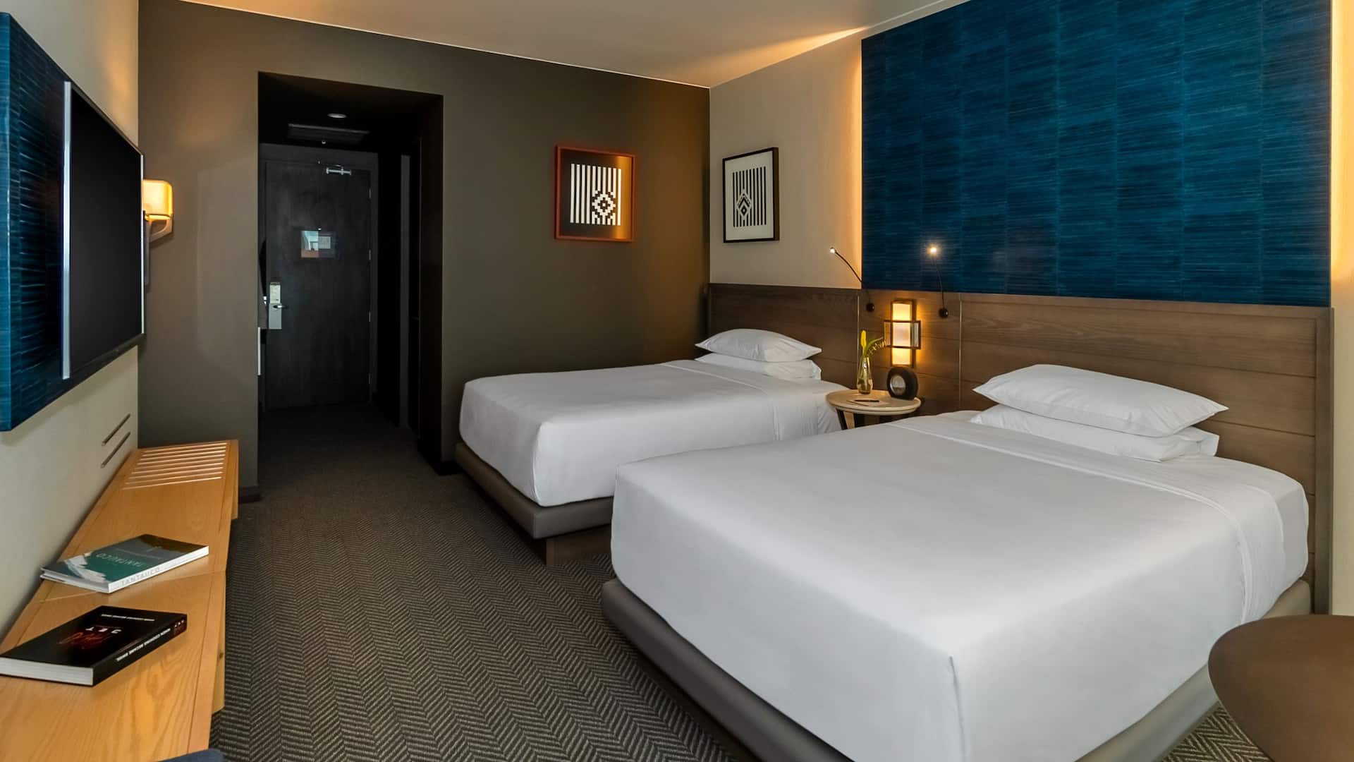 1 of 2 Two Queen Beds guest room with shared nightstand