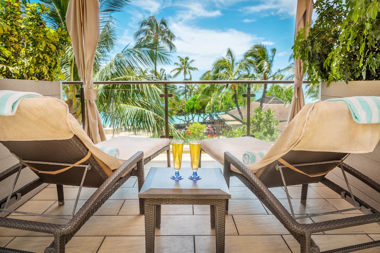 Pool Cabana with lounge chairs and an ocean view