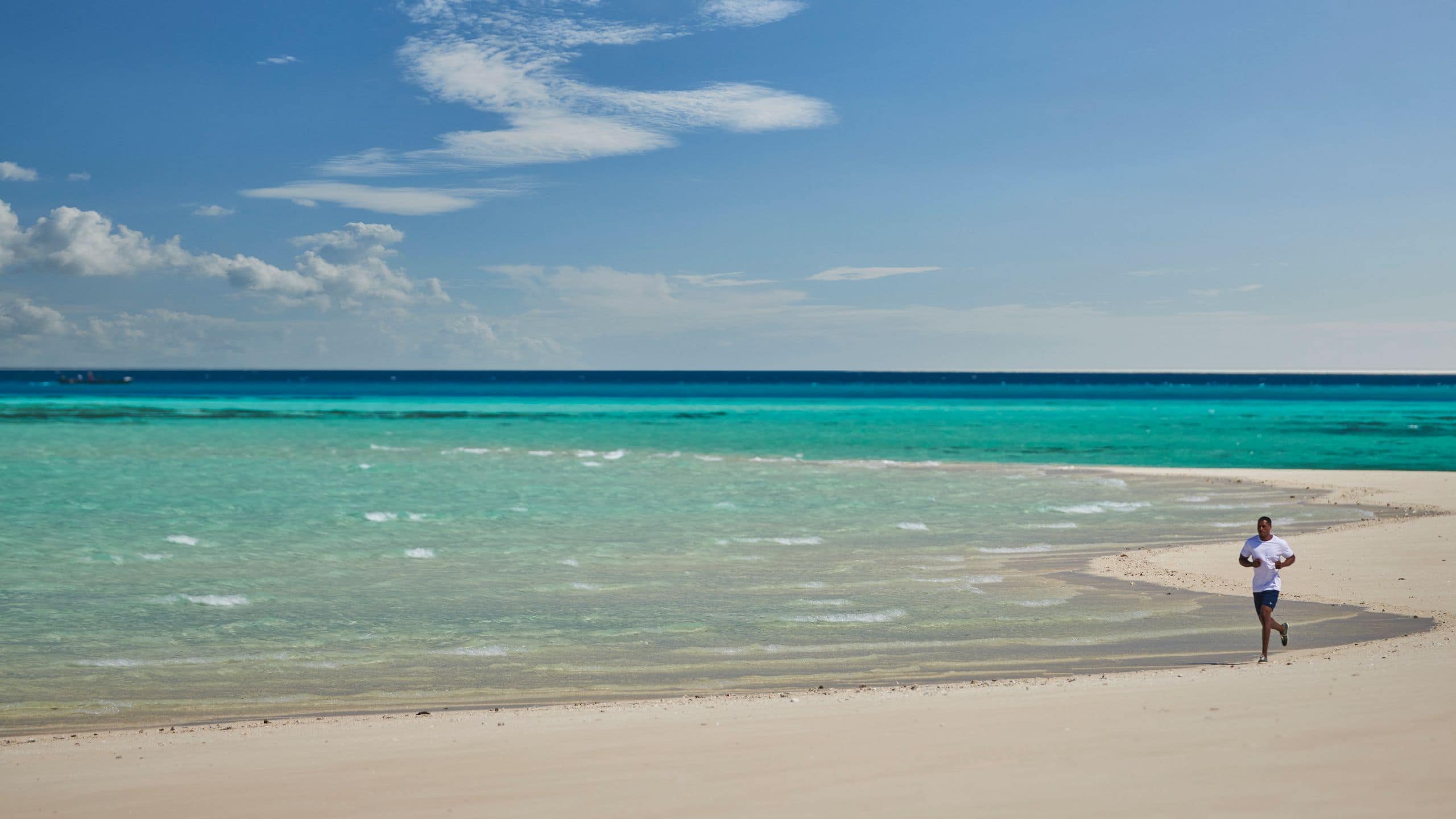 Park Hyatt Zanzibar Lifestyle Man Running On Beach
