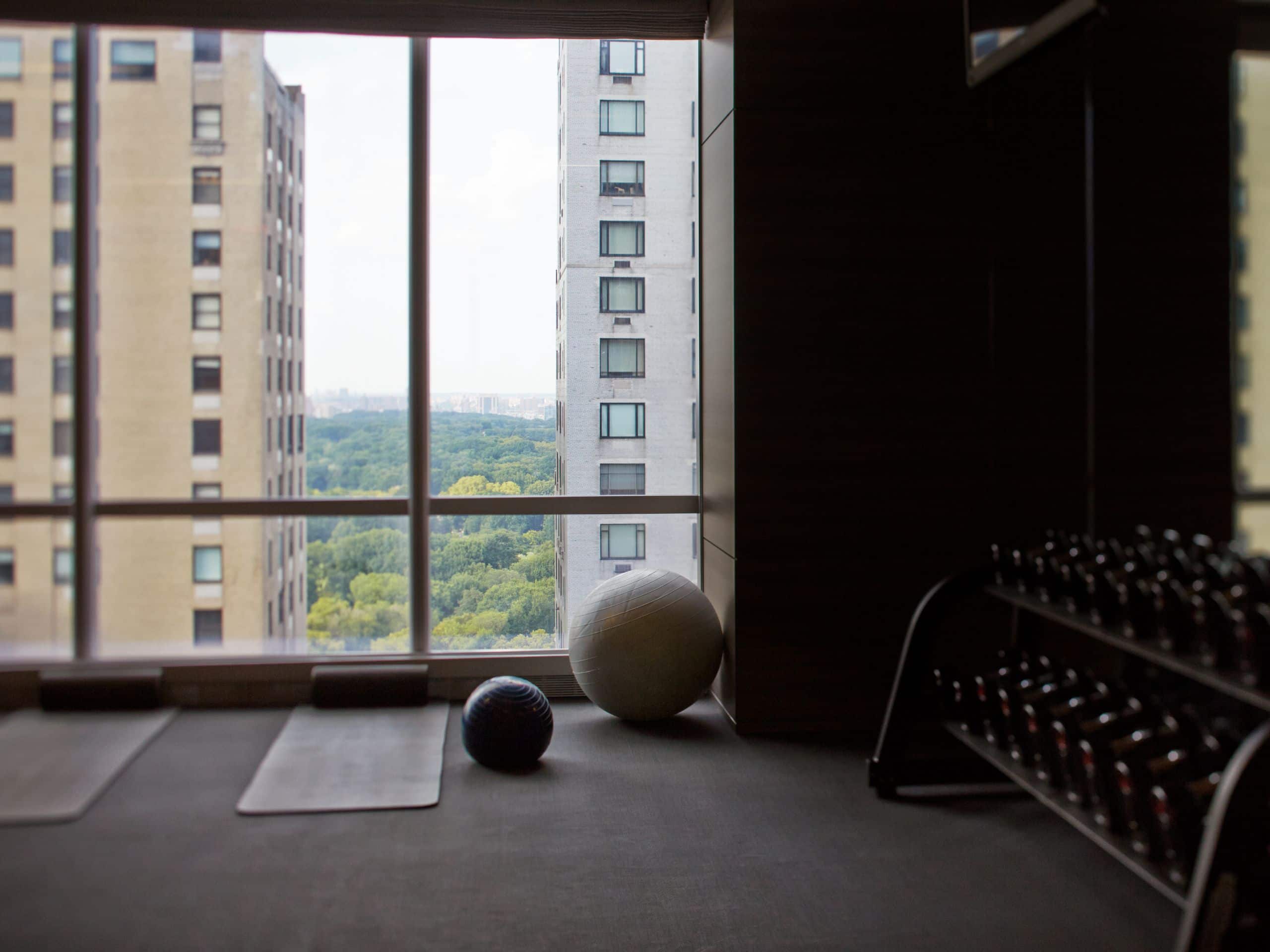 Hotel gym with weights excercise balls and yoga mats