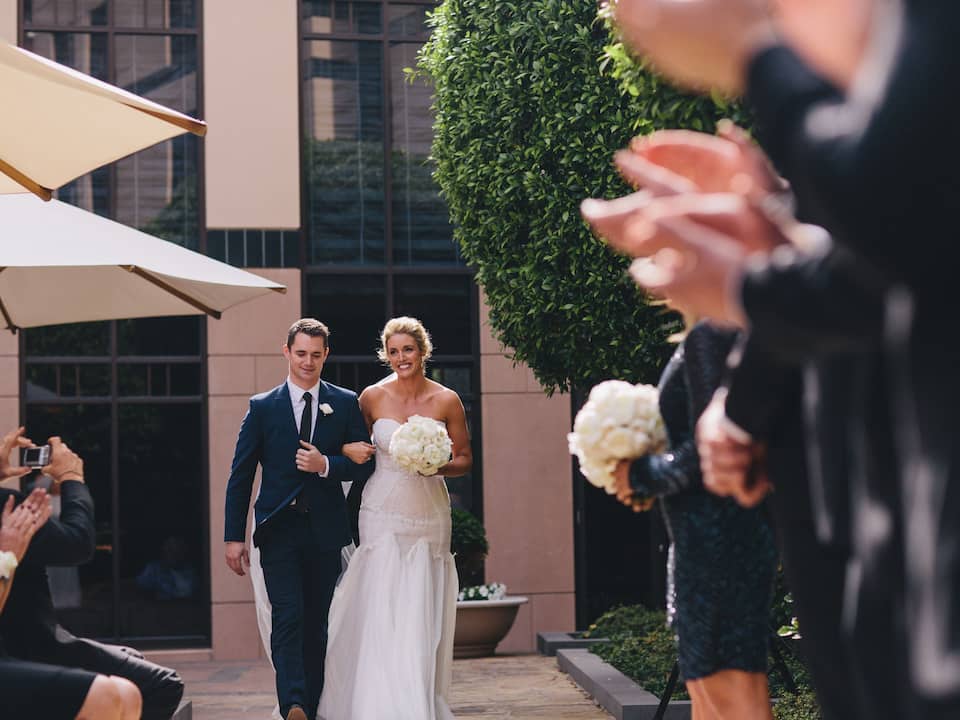 Wedding Bride and Groom Walking Down The Aisle
