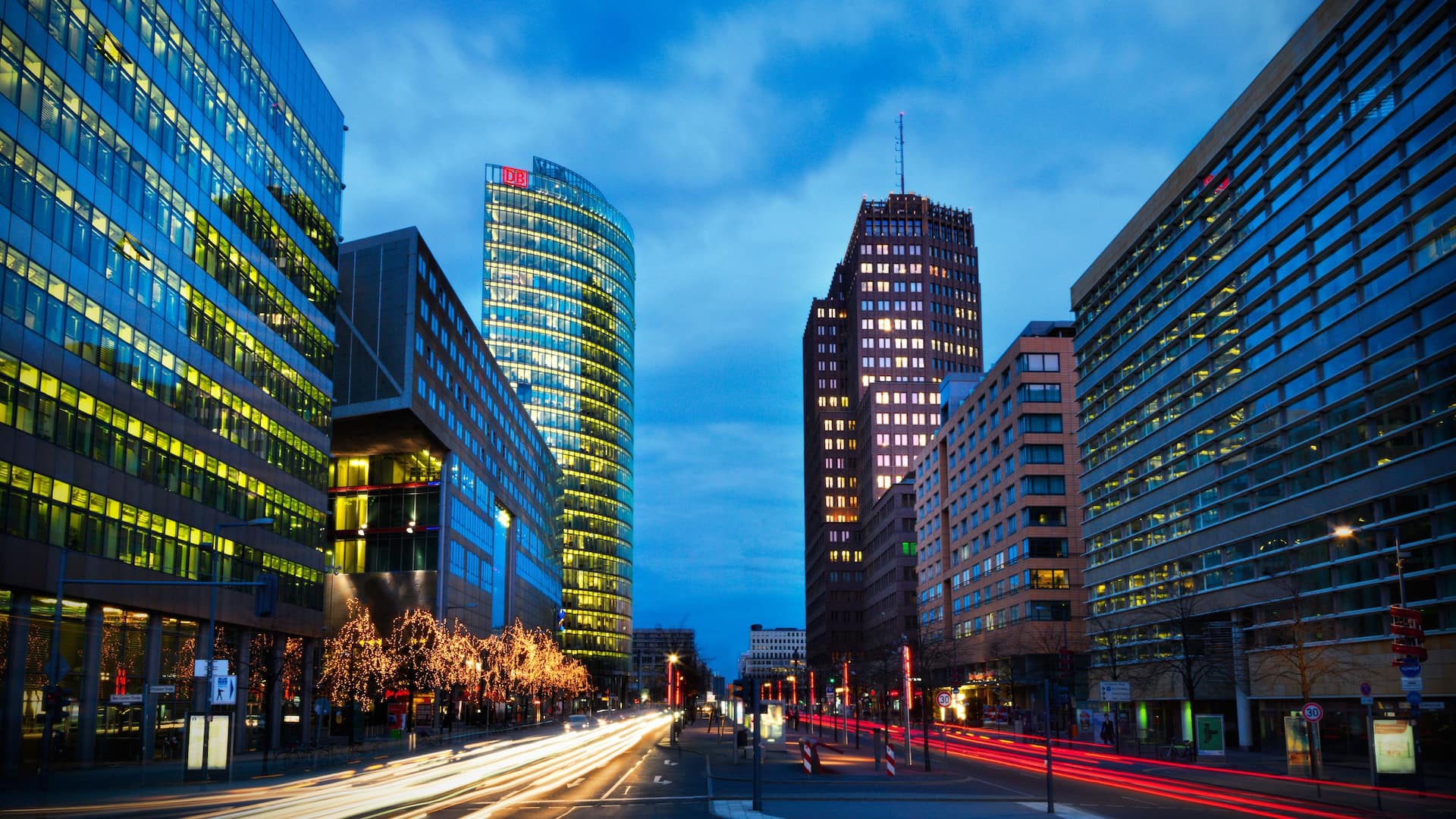 Potsdamer Platz with illuminated Kollhoff Tower and DB building in the evening near Grand Hyatt Berlin
