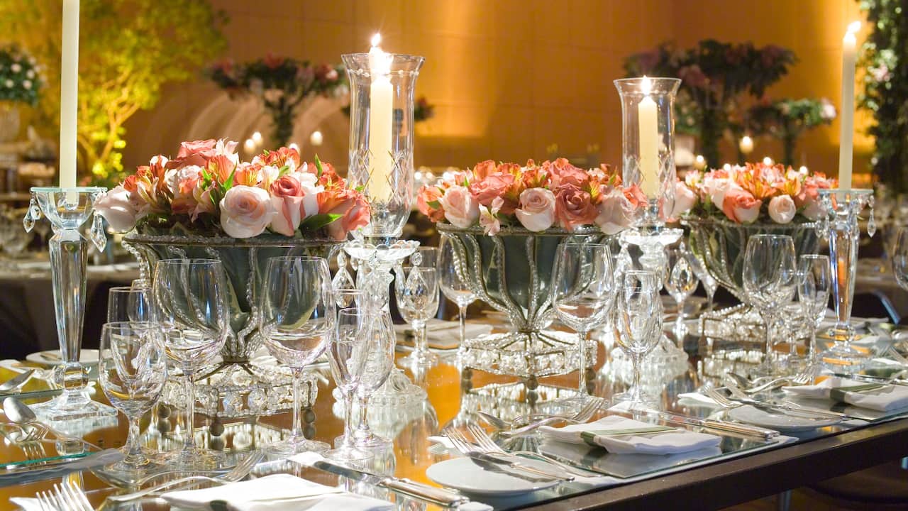 Wedding reception table detail with crystal, roses and candles